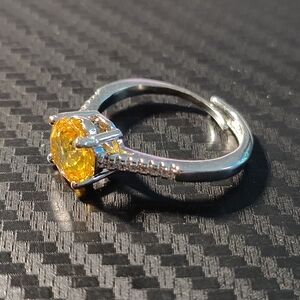 Elegant Silver Ring with Yellow Gemstone